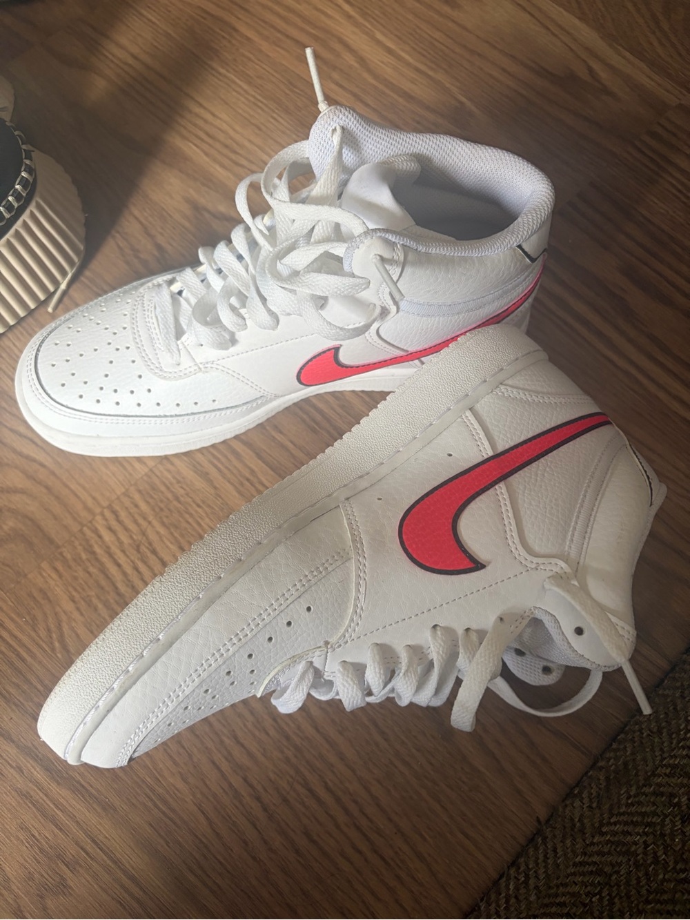 Nike Women’s White High-Top Sneakers with Pink Logo